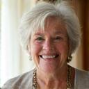 Portrait of a serene woman, Maria S., 62, enjoying a calm moment.